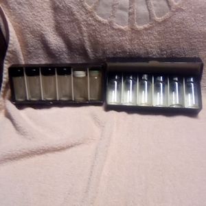 Small glass sample bottles and two vintage medicine bottles